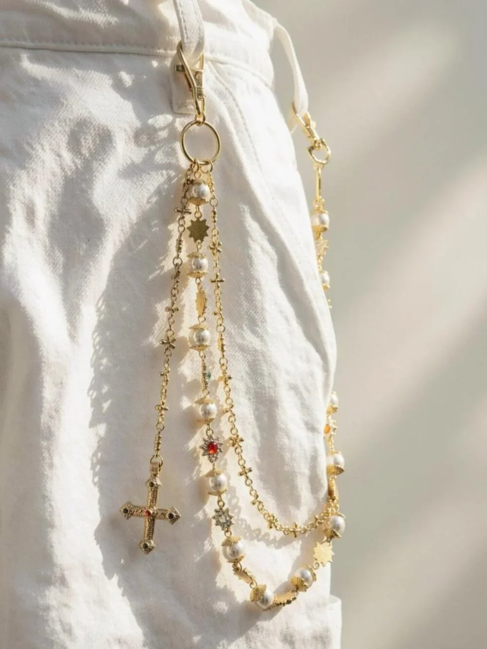 Y2k 2000s style gold chain belt with faux pearls and cross pendant